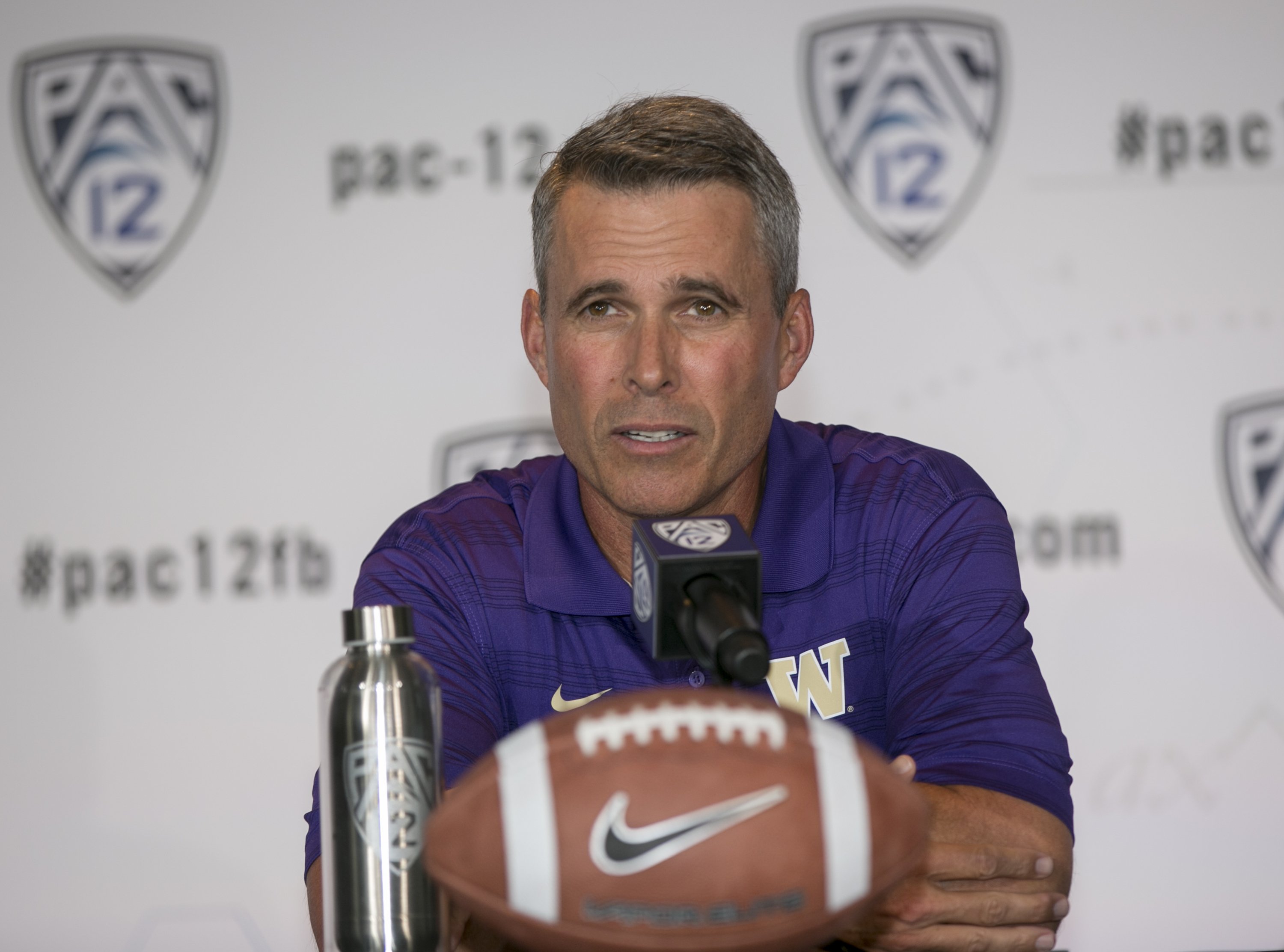 Washington head coach Chris Petersen takes questions at the 2014 Pac-12 NCAA college football media days at Paramount Studios in Los Angeles Thursday, July 24, 2014. (AP Photo)  CADD103